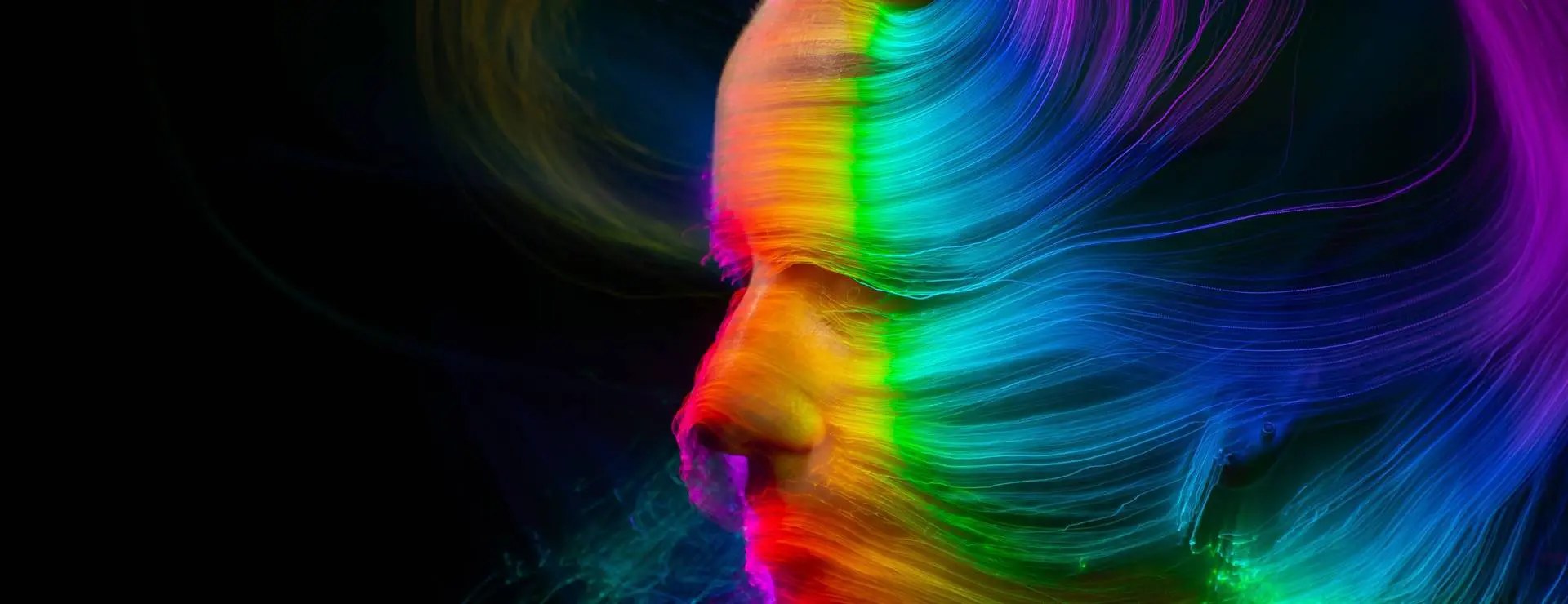 A blurry image of a person 's face with rainbow colors.